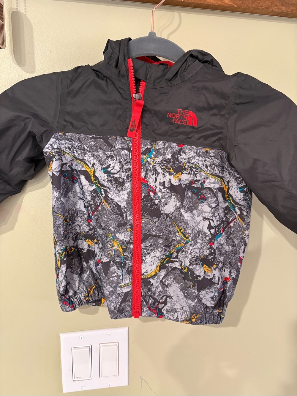 The North Face Kids' Hooded Jacket — Black with Red & Multicolor Abstract Print